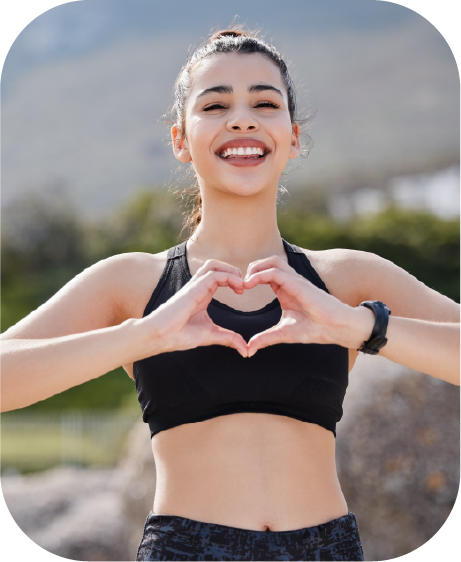 Girl is smiling with heart pose
